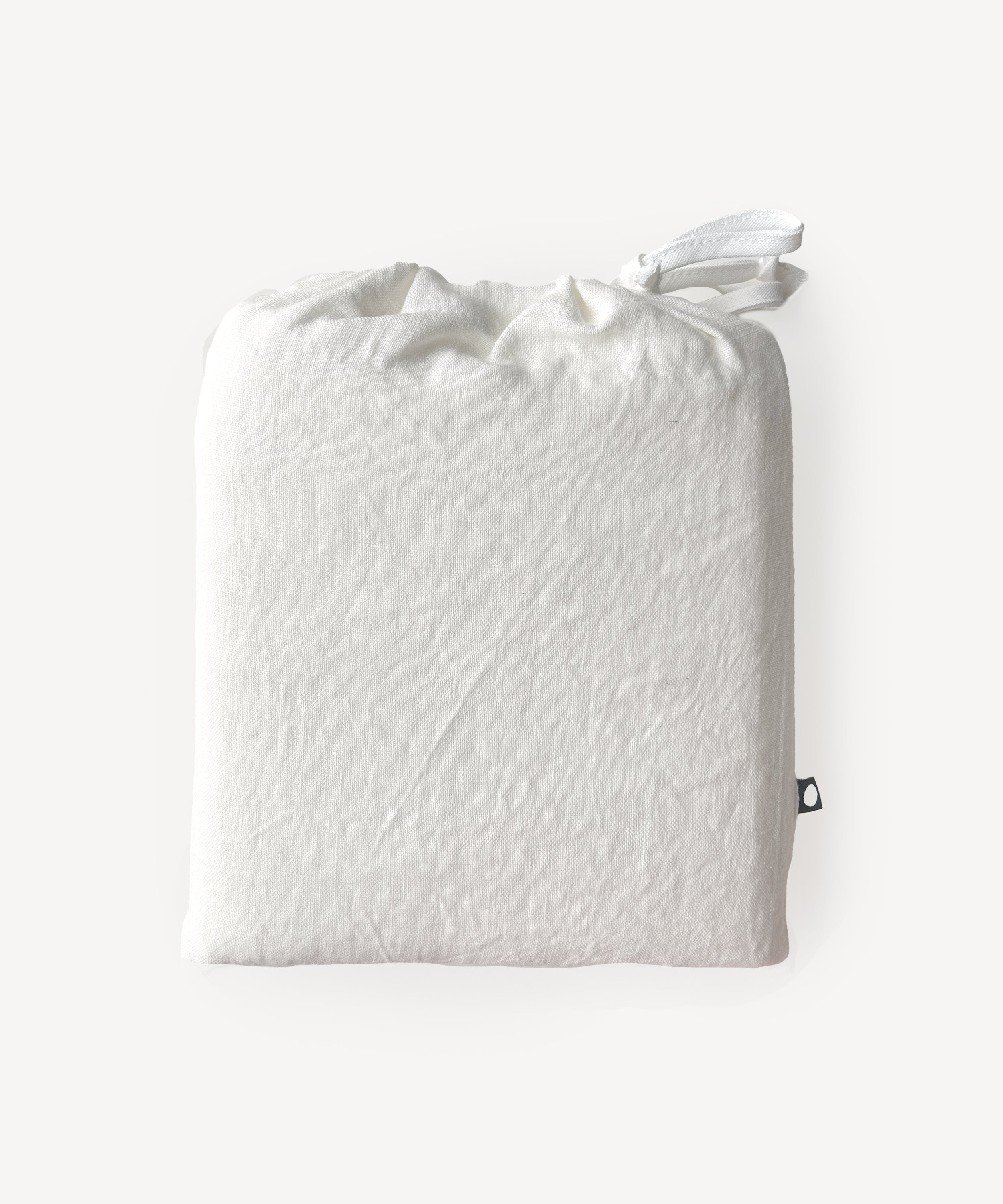 A folded white Crib/Toddler Fitted Sheet with a drawstring, displayed on a plain light background.