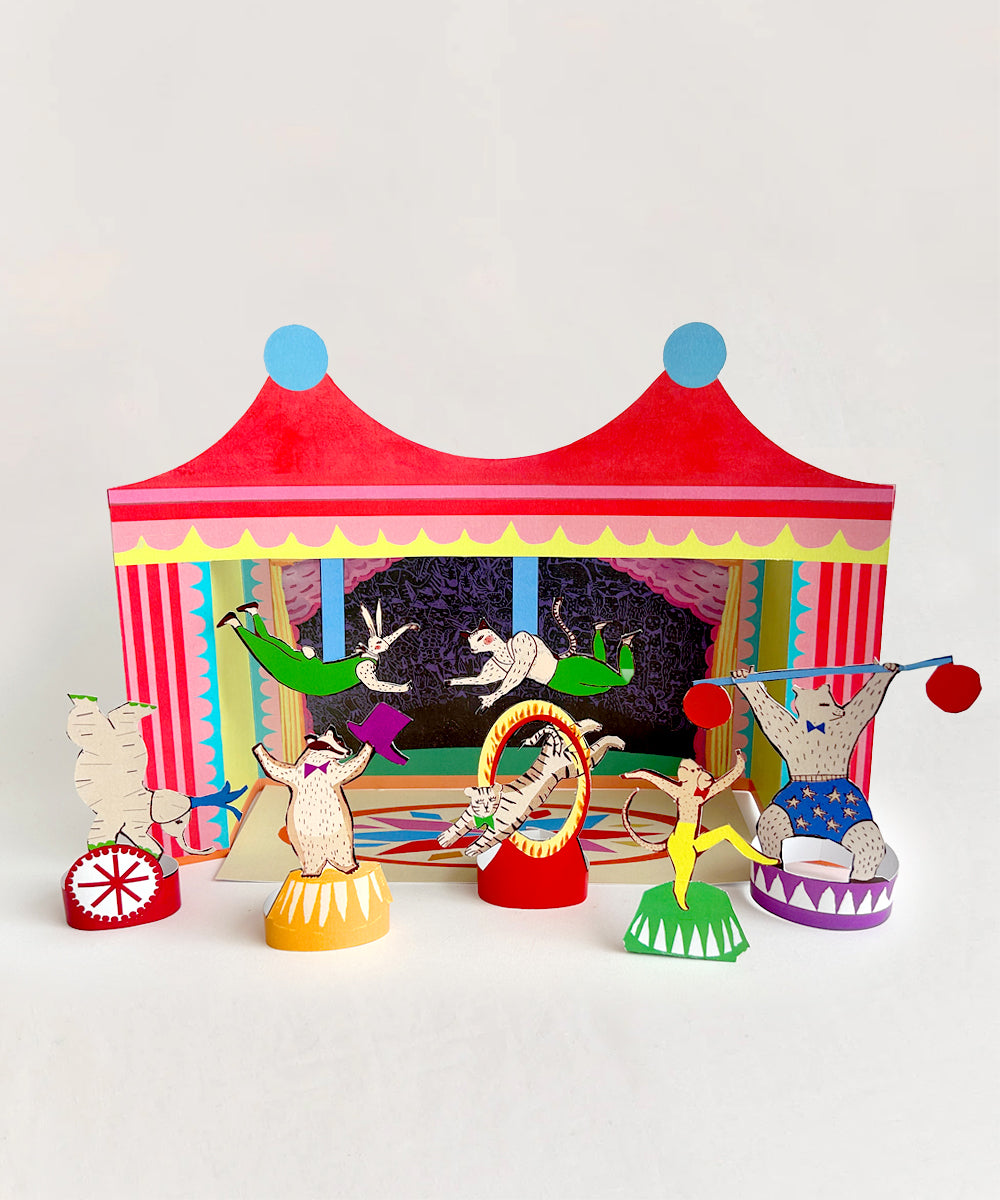 Le Cut and Make Circus features a colorful paper circus scene with animal performers set before a striped tent backdrop.