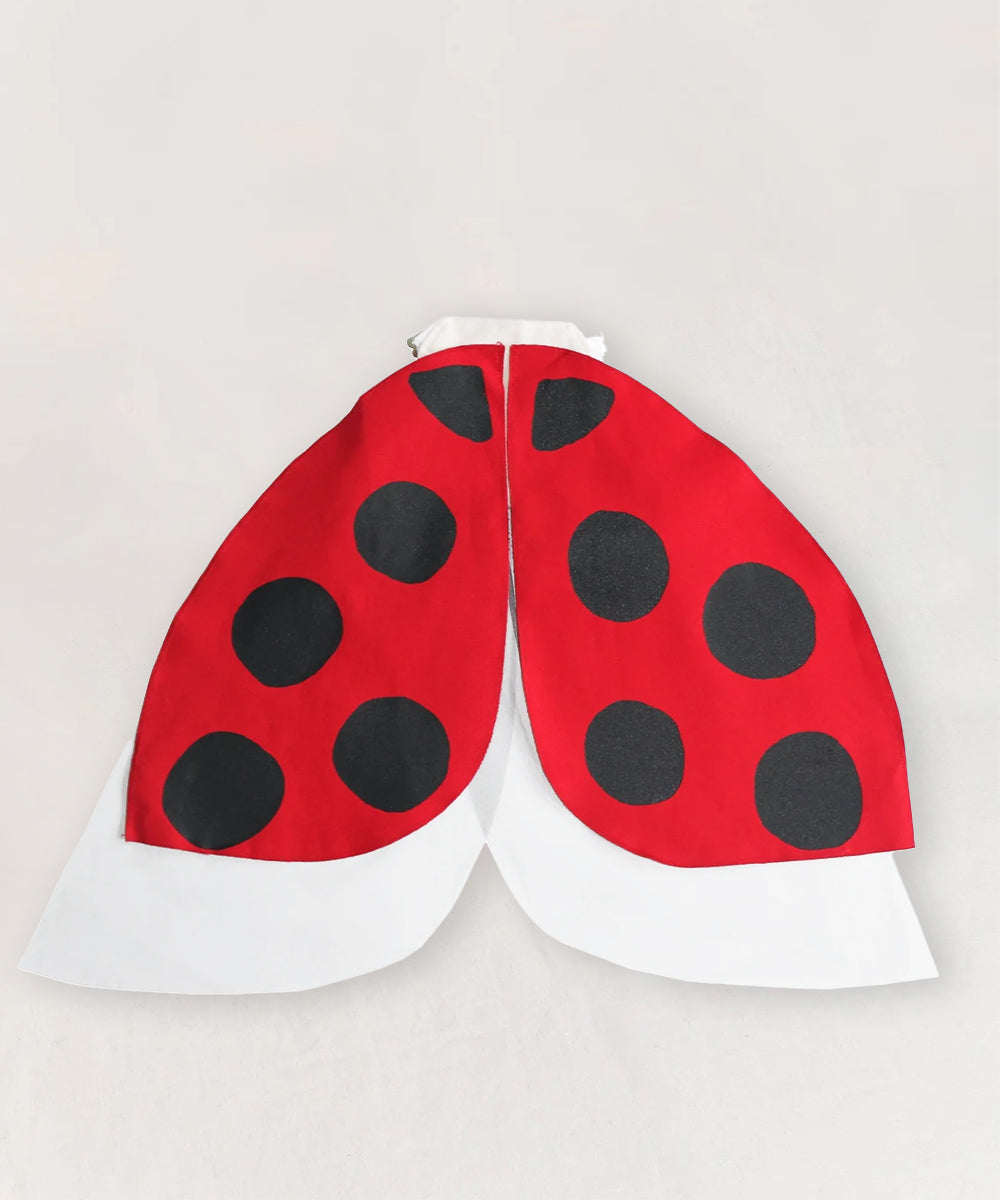 Ladybug Wings in red and black with white accents, laid flat on a light background.