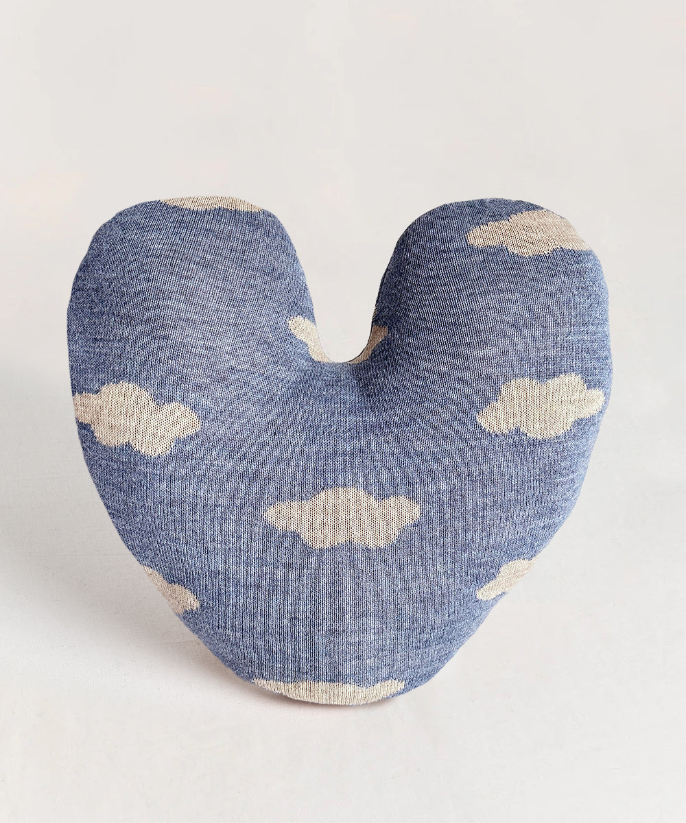 Heart Cloud Pillow featuring a heart shape with blue fabric and white cloud patterns on a light gray background.