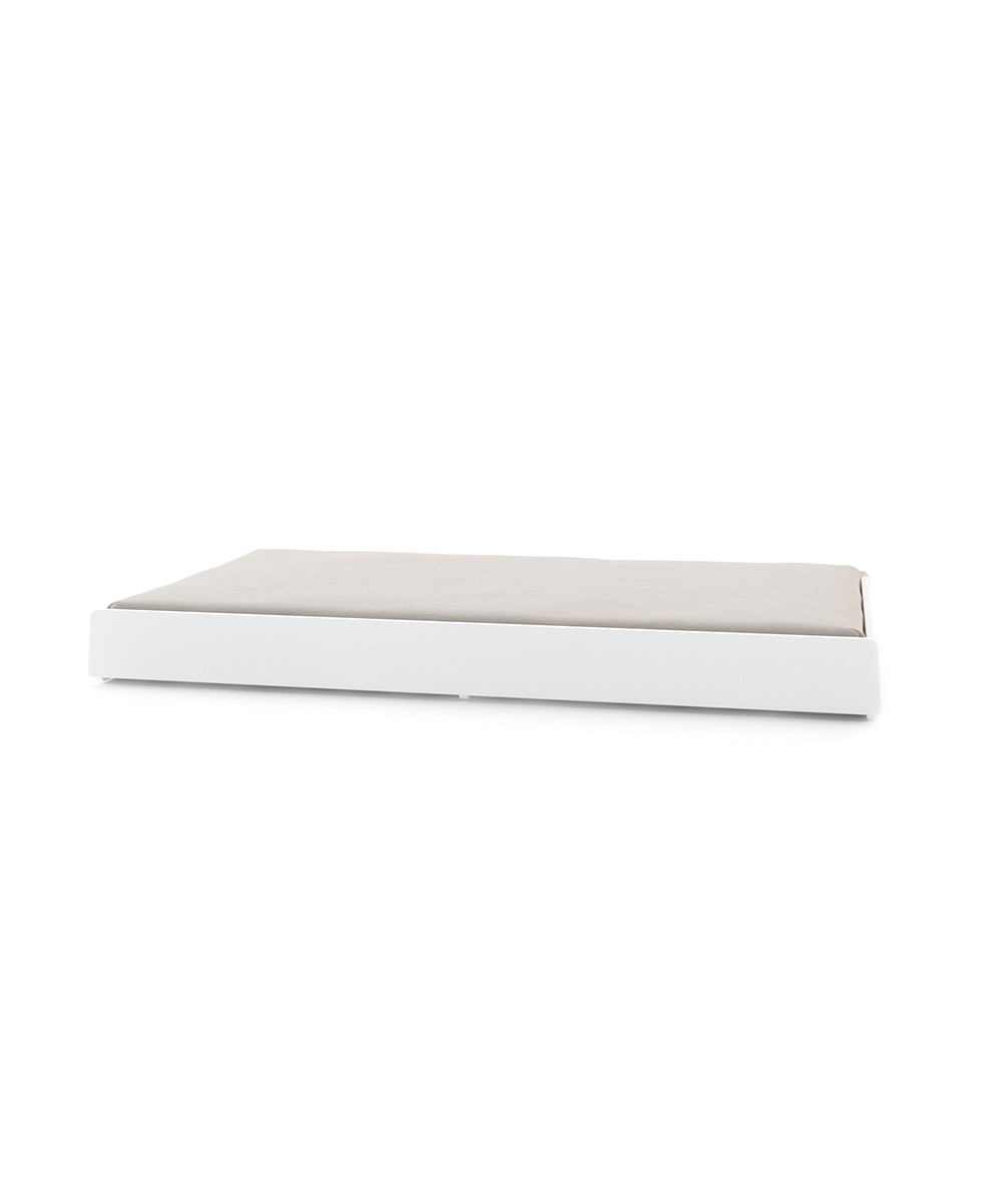 Trundle Mattress: A rectangular, low-profile white platform with a beige cushion, set against a white background.